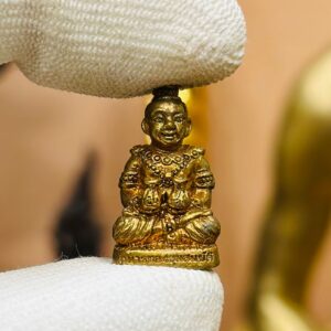 【古曼童抱钱袋】